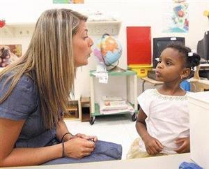 teacher working with a student teacher working with a student